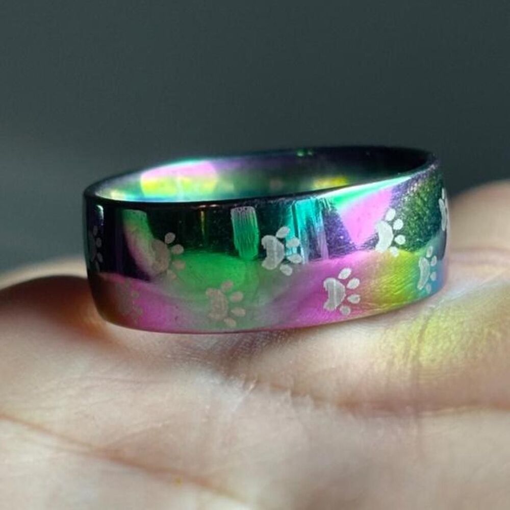 Rainbow titanium ring with engraved paws